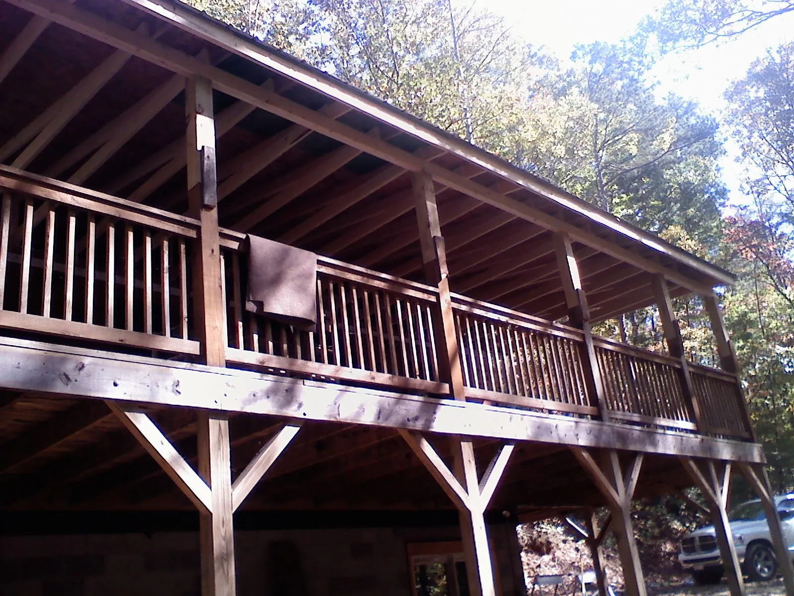 Timber framing under a new elevated porch and deck — Roof Leak Repair in Sidney Center by Roofing Brothers